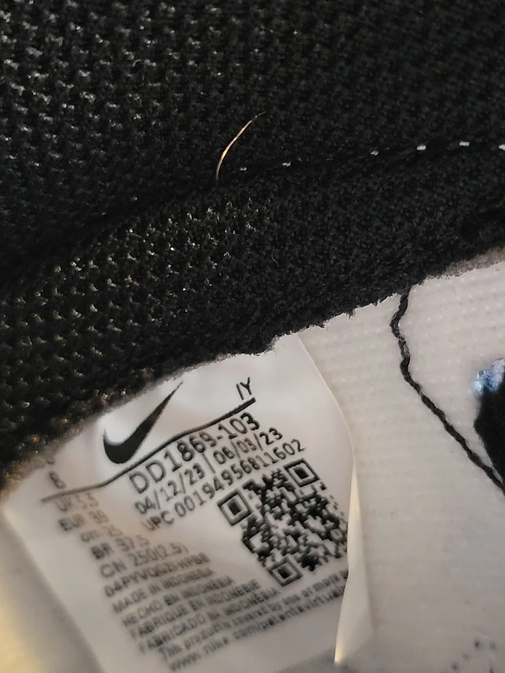Nike Men’s Black & White Mid-Top Sneakers with Red Logo